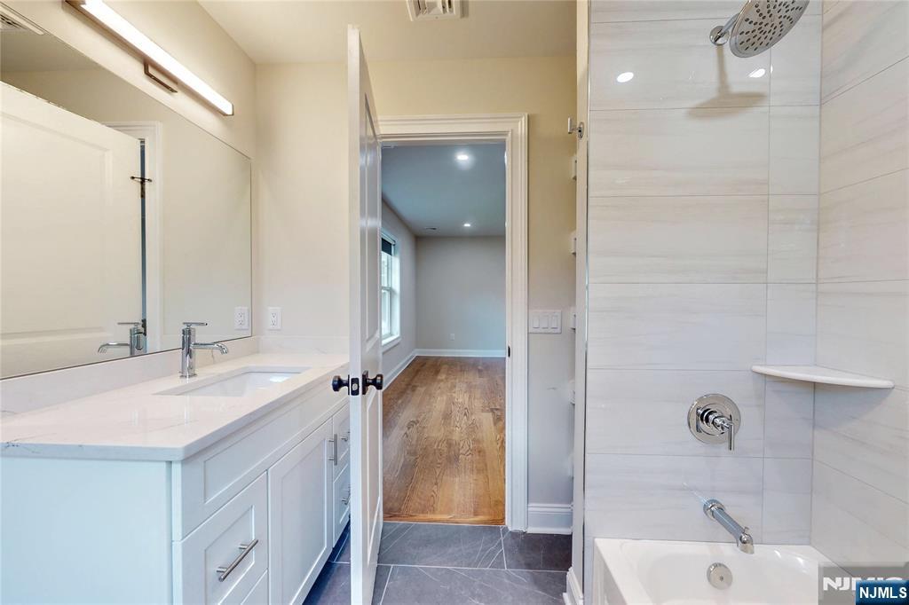 19 Meadowbrook Road Upper Saddle River, NJ 07458 - Photo 32 of 47 a bathroom with a sink a toilet and shower