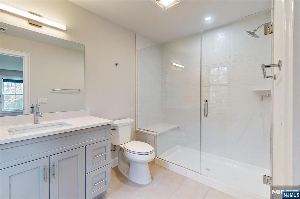 19 Meadowbrook Road Upper Saddle River, NJ 07458 - Photo 35 of 47 a bathroom with a sink a toilet and shower