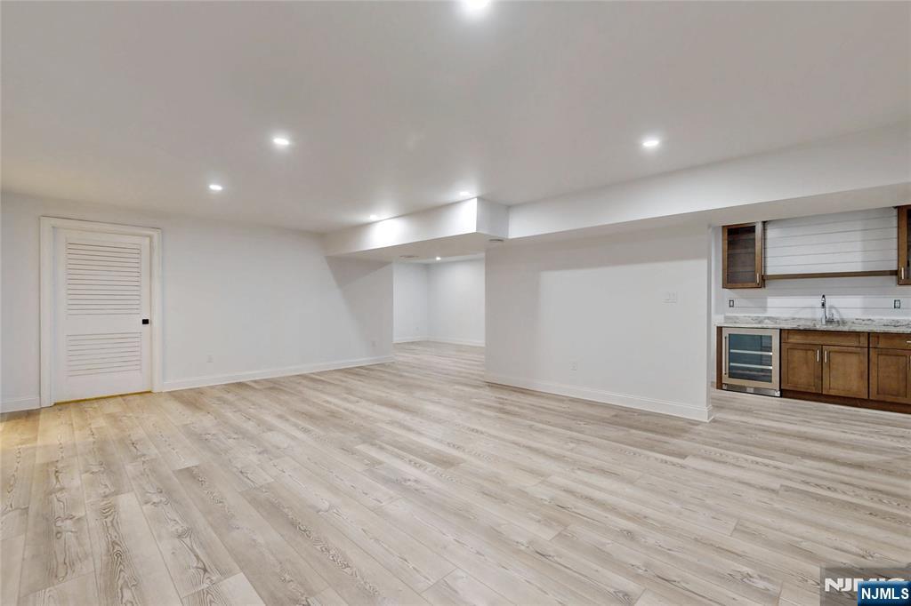 19 Meadowbrook Road Upper Saddle River, NJ 07458 - Photo 38 of 47 a view of a kitchen with a sink and a stove top oven