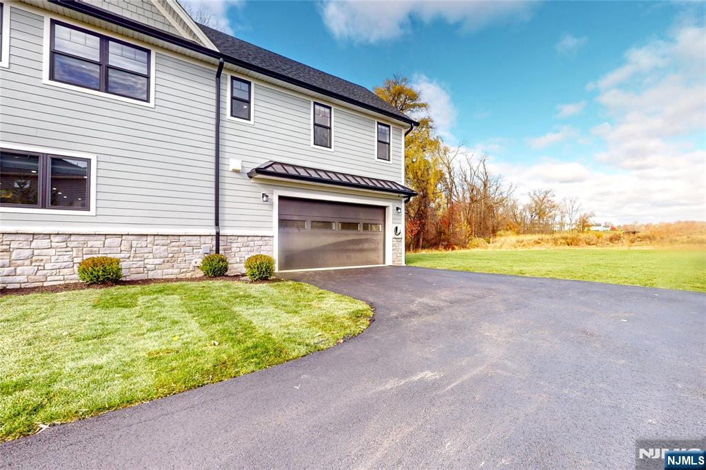 19 Meadowbrook Road Upper Saddle River, NJ 07458 - Photo 44 of 47 a house view with a outdoor space