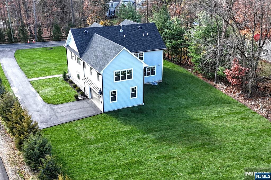19 Meadowbrook Road Upper Saddle River, NJ 07458 - Photo 45 of 47 a aerial view of a house with a yard