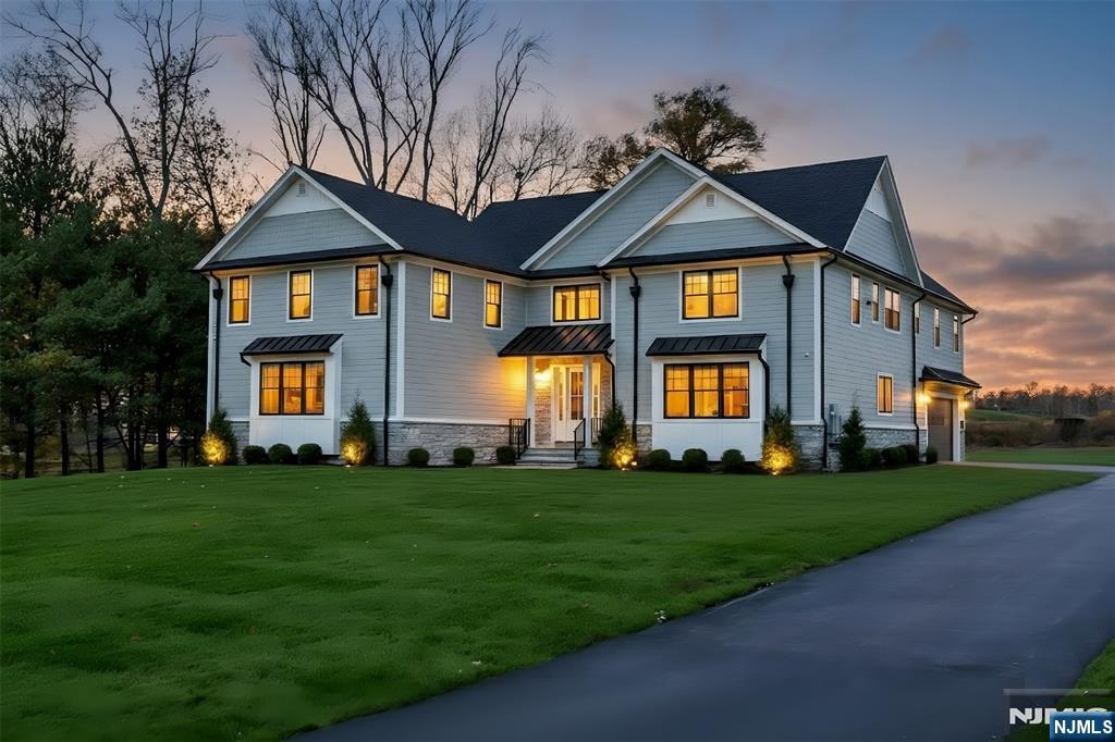 19 Meadowbrook Road Upper Saddle River, NJ 07458 - Photo 47 of 47 a front view of a house with a yard