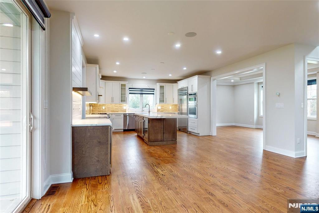 19 Meadowbrook Road Upper Saddle River, NJ 07458 - Photo 10 of 47 a view of kitchen with kitchen island and stainless steel appliances