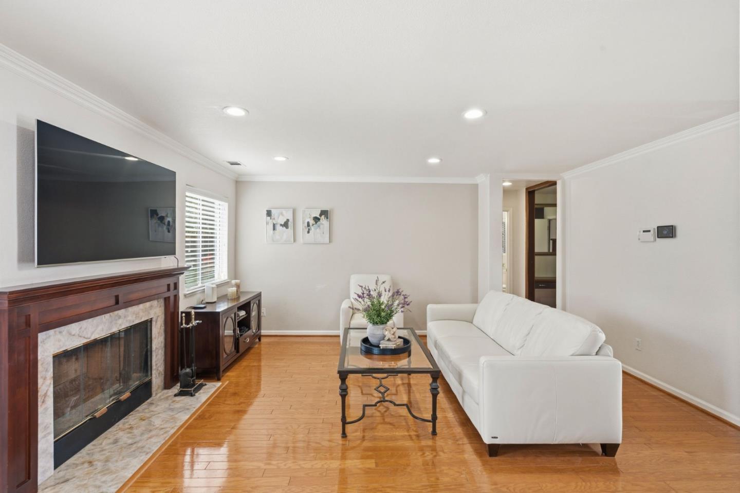 35 Sierra Ridge Court Danville, CA 94506 - Photo 17 of 37 a living room with furniture a flat screen tv and a fireplace