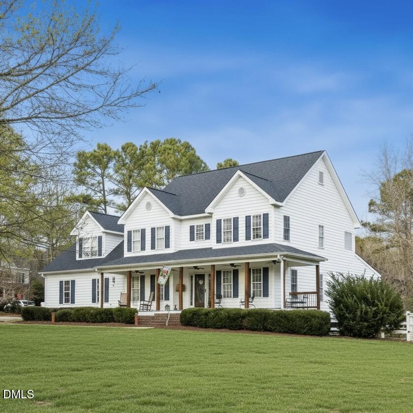 5908 Deep Spring Circle Wake Forest, NC 27587 - Photo 1 of 51 a front view of a house with a garden
