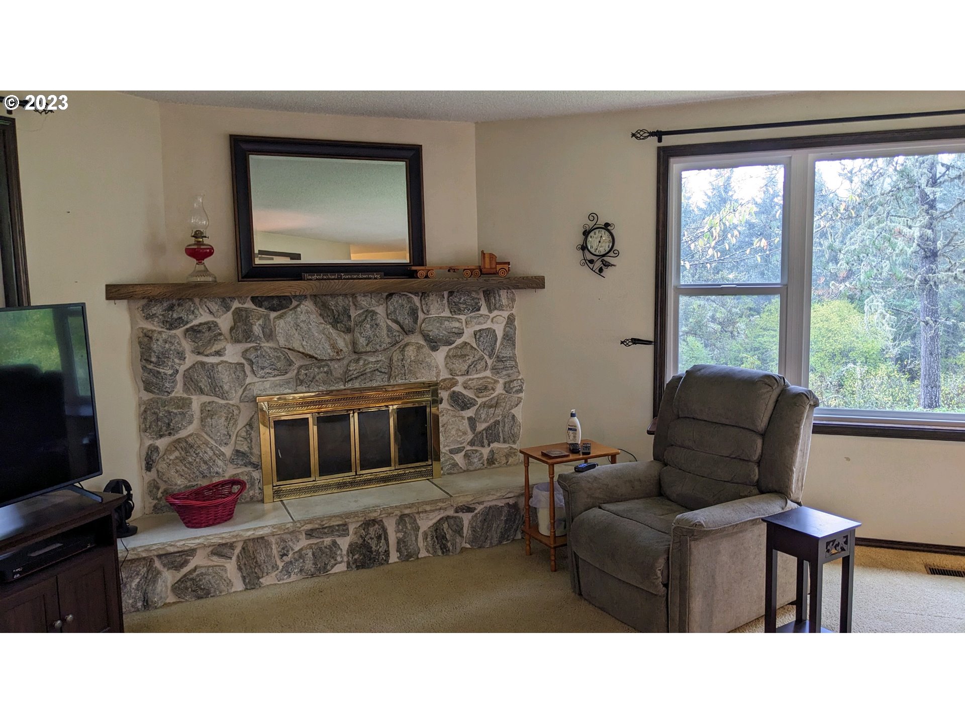 17600 Shady Lane Road Monmouth, OR 97361 - Photo 11 of 44 a living room with furniture and a fireplace