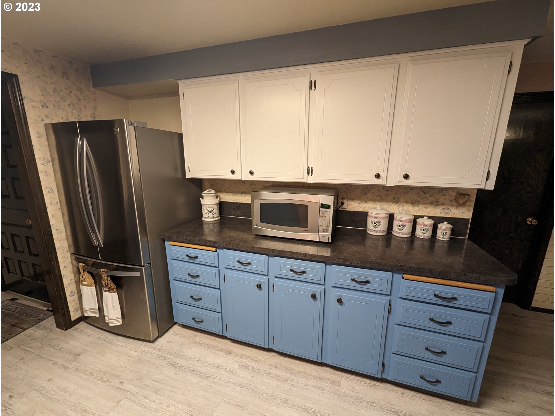 17600 Shady Lane Road Monmouth, OR 97361 - Photo 15 of 44 a kitchen with granite countertop white cabinets and stainless steel appliances