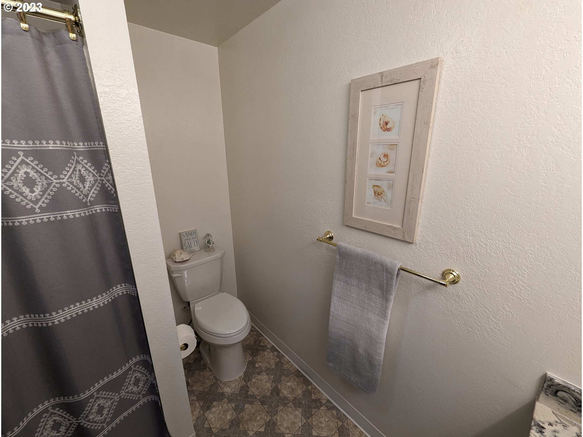 17600 Shady Lane Road Monmouth, OR 97361 - Photo 27 of 44 a bathroom with a granite countertop toilet and a sink