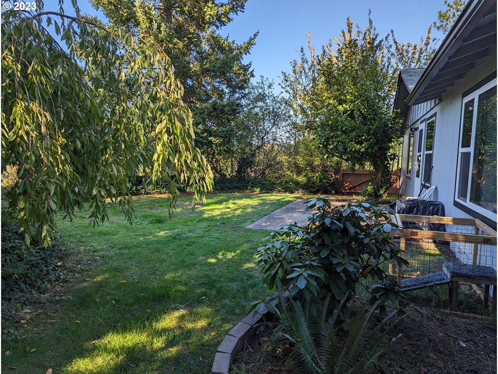 17600 Shady Lane Road Monmouth, OR 97361 - Photo 32 of 44 a view of backyard with table and chairs and potted plants