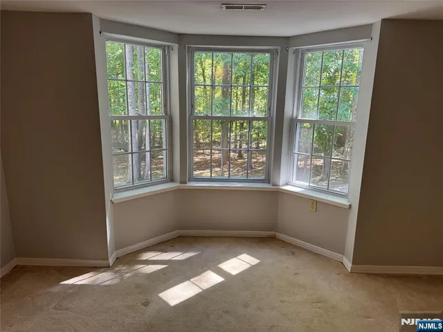 a kitchen that has a stove and a window