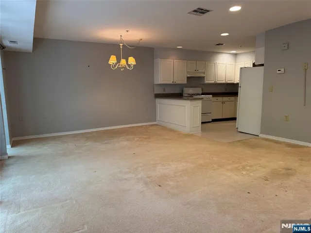 a view of an empty room with a balcony