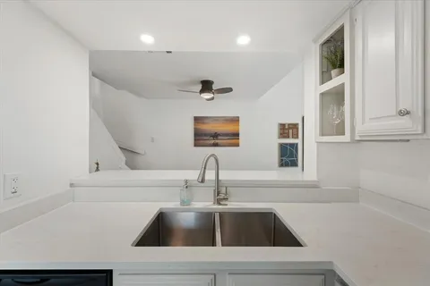 a kitchen with a sink and a window