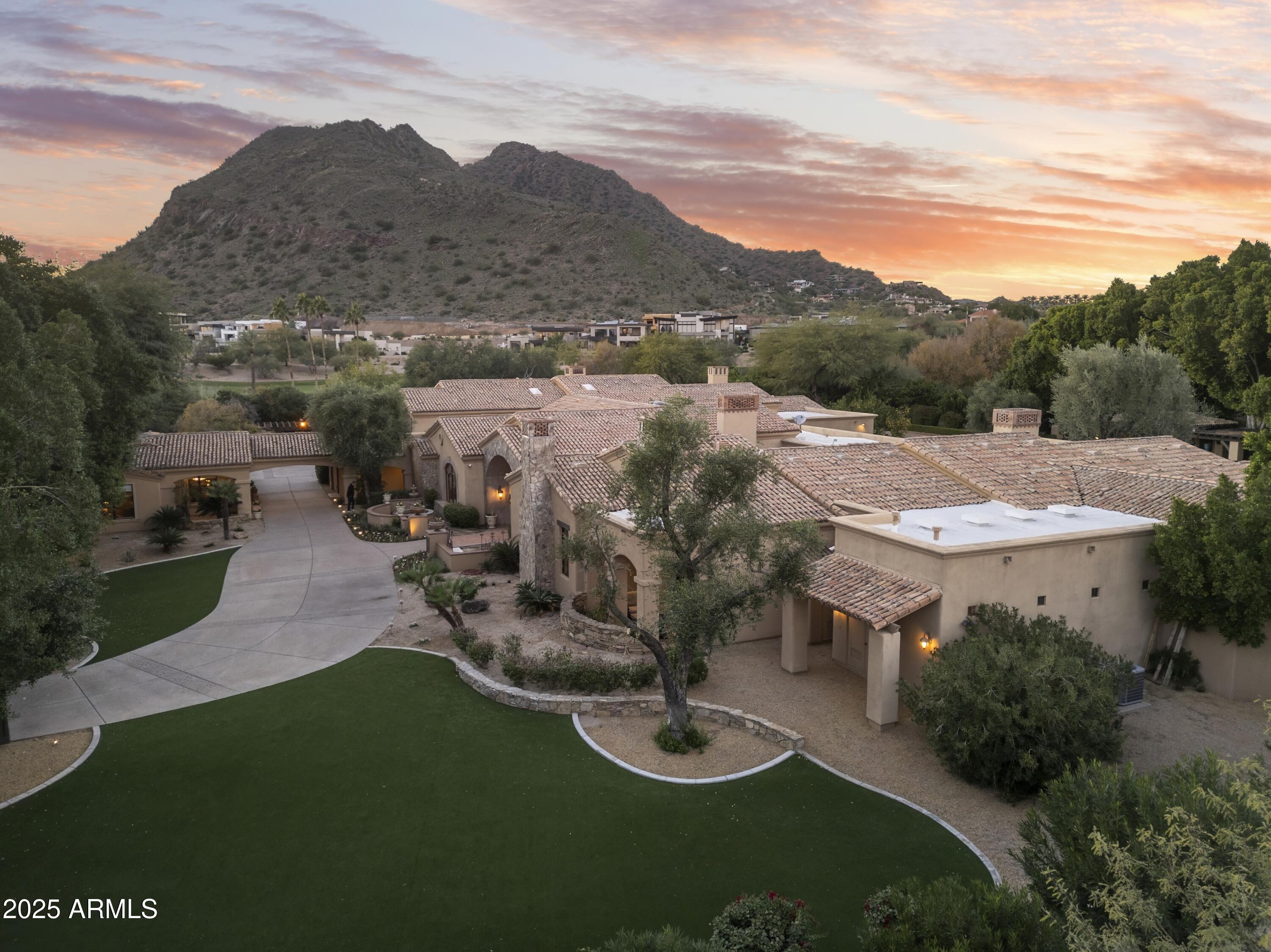 6402 East Chaparral Road Paradise Valley, AZ 85253 - Photo 111 of 125 a aerial view of a house with garden space and street view