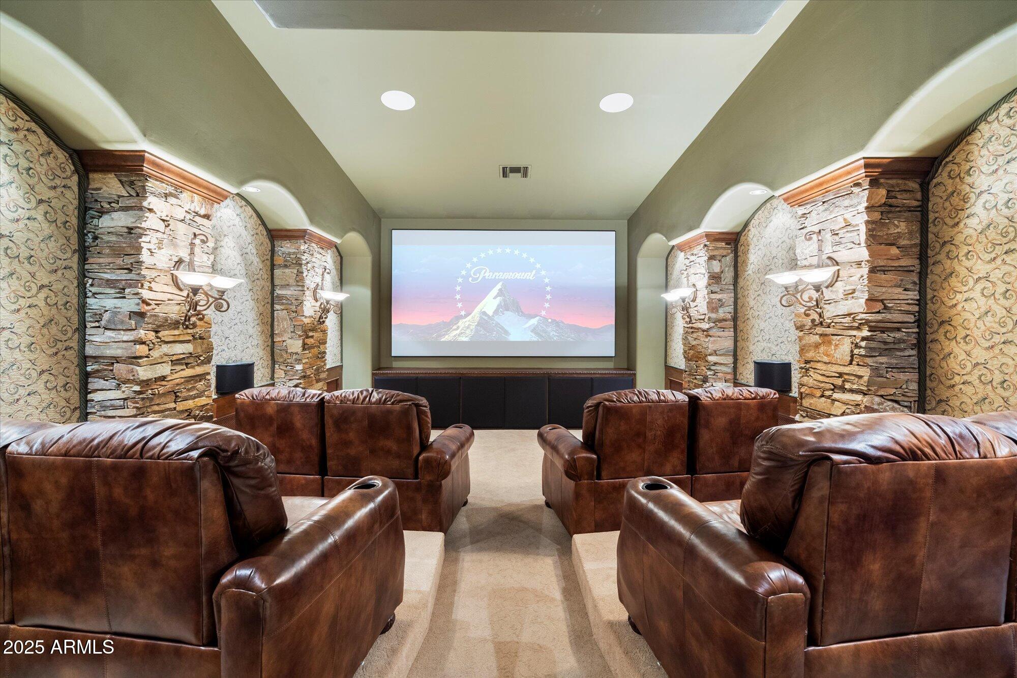 6402 East Chaparral Road Paradise Valley, AZ 85253 - Photo 36 of 125 a living room with furniture a large window and a flat screen tv