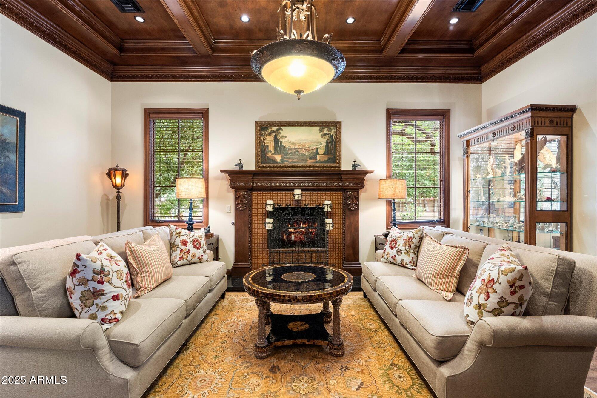 6402 East Chaparral Road Paradise Valley, AZ 85253 - Photo 61 of 125 a living room with furniture and a fireplace