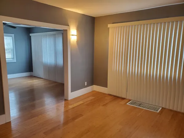 a kitchen with stainless steel appliances granite countertop a white cabinets and a stove top oven