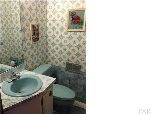 7495 Gunter Road Pensacola, FL 32526 - Photo 11 of 25 1/2 bathroom downstairs for guests.