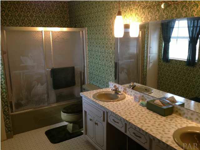 7495 Gunter Road Pensacola, FL 32526 - Photo 20 of 25 Full guest bathroom with double vanity on second level