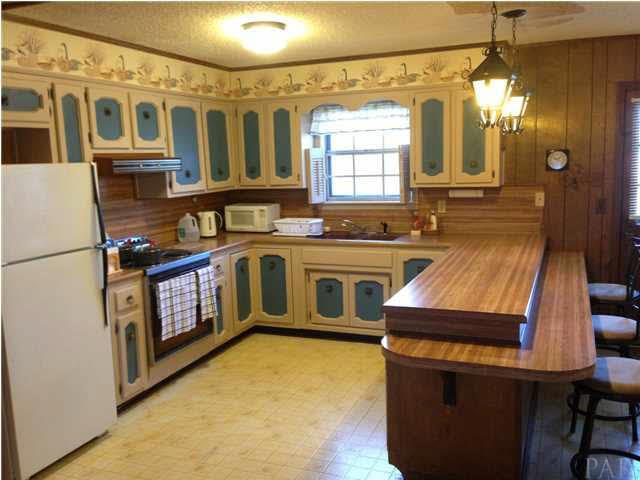 7495 Gunter Road Pensacola, FL 32526 - Photo 3 of 25 Kitchen - equipped with refrigerator, electric stove/oven, and dishwasher.