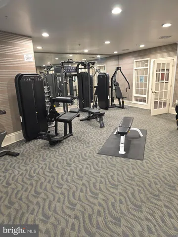 a view of an empty room with stairs and ventilation