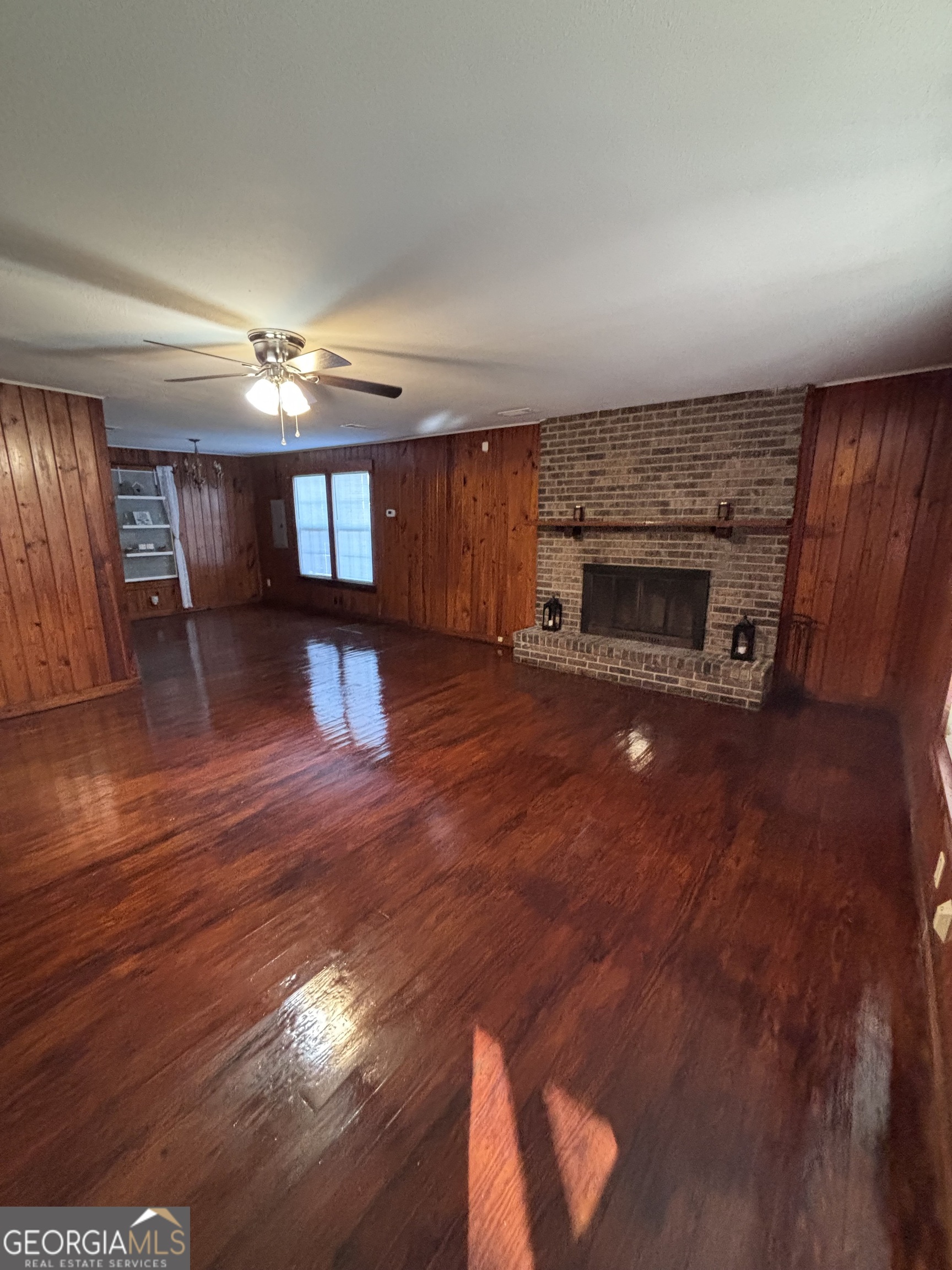 44 Olympic Lane St. Marys, GA 31558 - Photo 3 of 10 a view of a livingroom with a fireplace and window