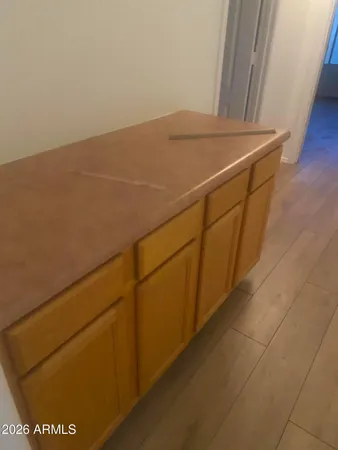 a spacious bathroom with a sink a mirror and a vanity