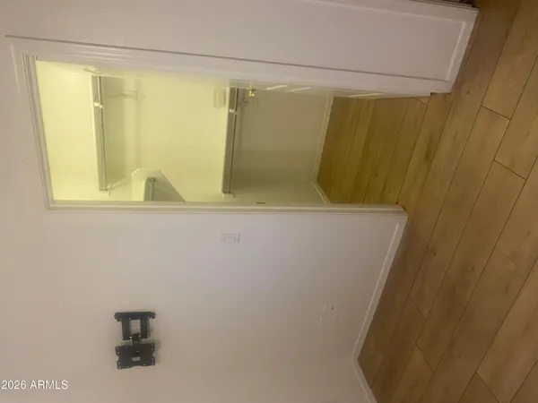 a view of hallway with wooden floor