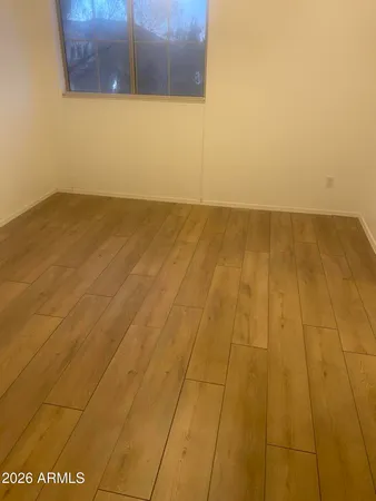 a view of hallway with wooden floor