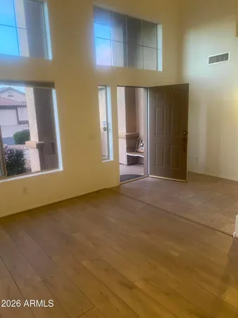 a view of empty room with a fireplace