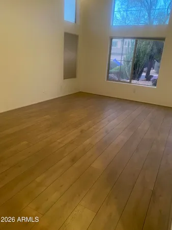 a view of empty room with a fireplace