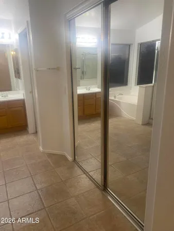 a bathroom with a glass door shower