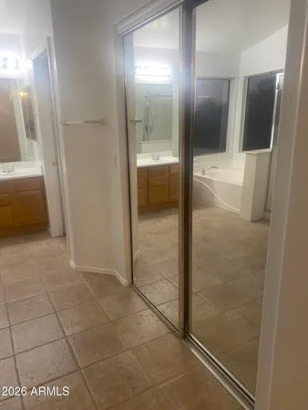 a bathroom with a glass door shower