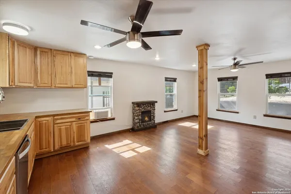 a kitchen with stainless steel appliances a refrigerator and a stove top oven