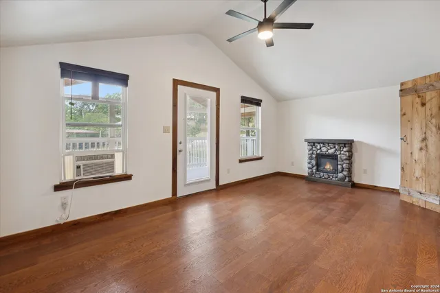 a view of balcony with wooden floor