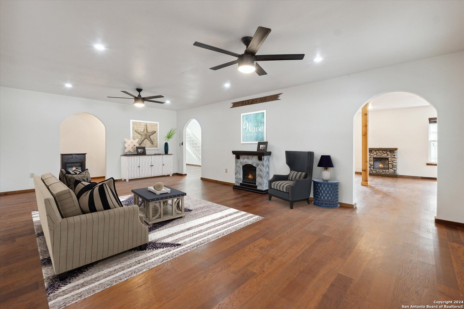 497 Black Bass Road Lakehills, TX 78063 - Photo 4 of 54 a living room with furniture and a ceiling fan