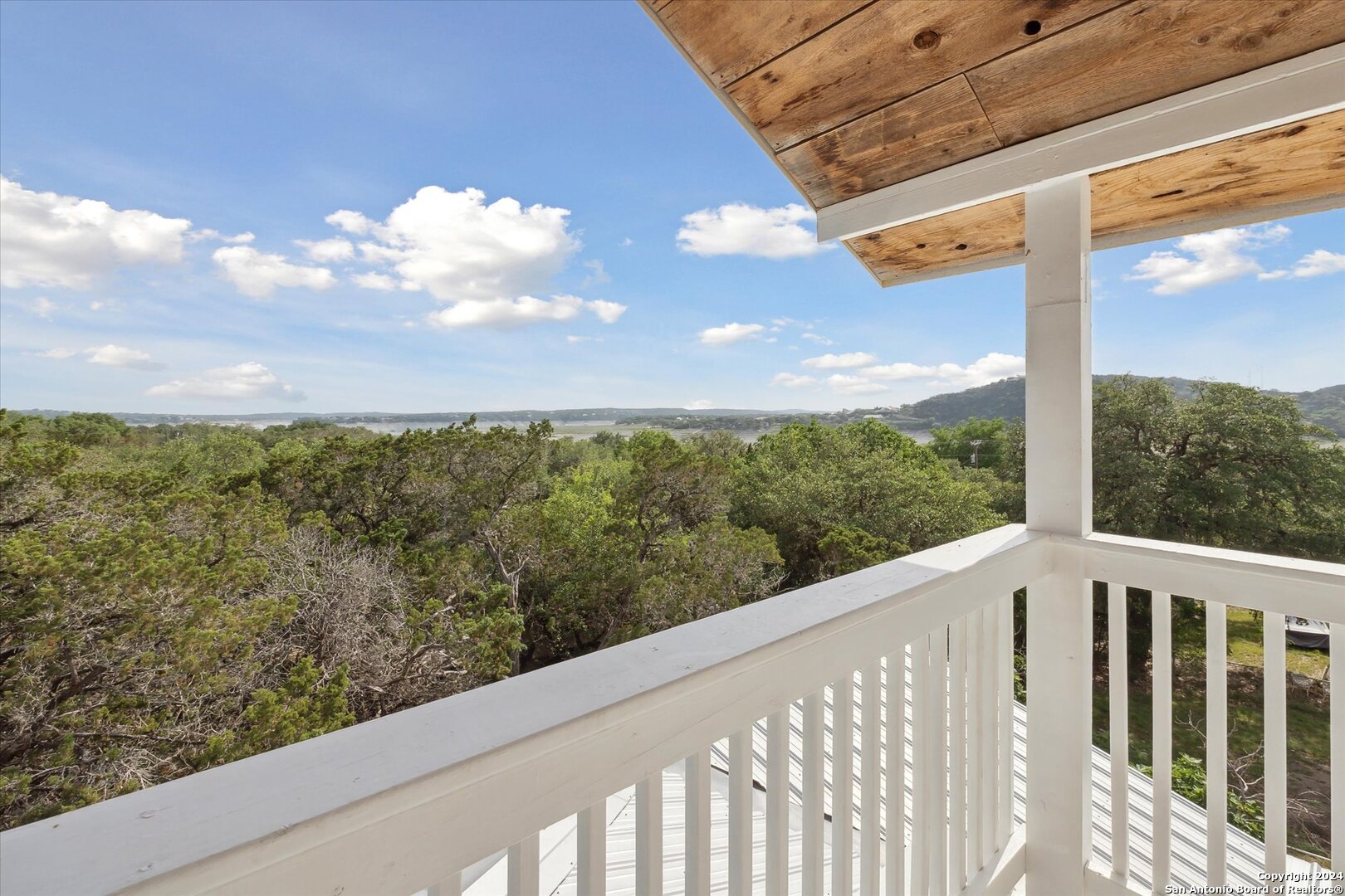 497 Black Bass Road Lakehills, TX 78063 - Photo 41 of 54 a view of a balcony with an outdoor space