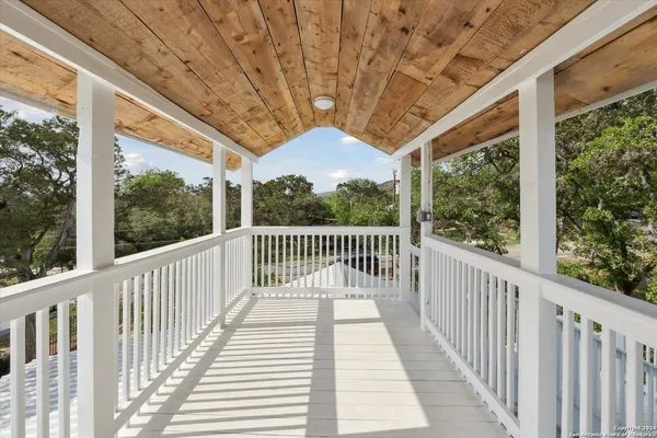 a view of a balcony with an outdoor space