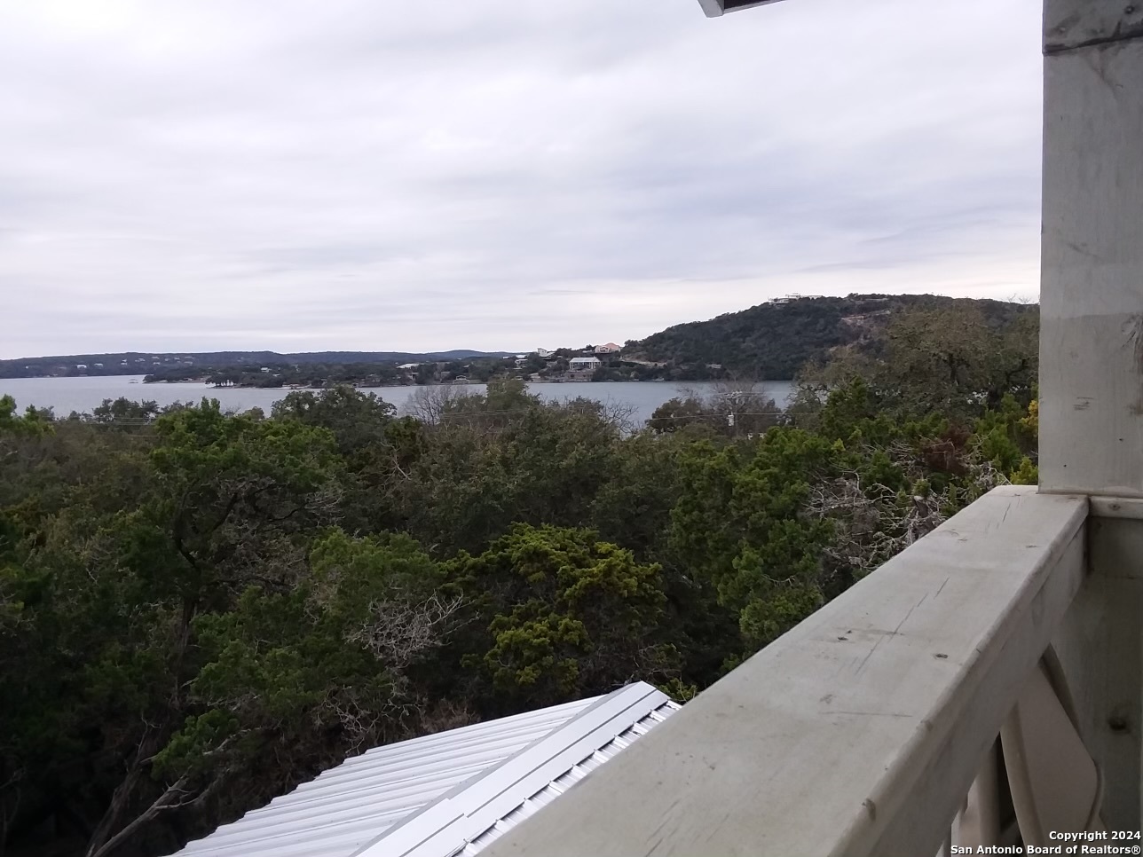 497 Black Bass Road Lakehills, TX 78063 - Photo 47 of 54 a view of a balcony with an outdoor seating