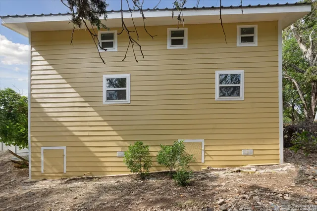 a view of a house with a yard and garage