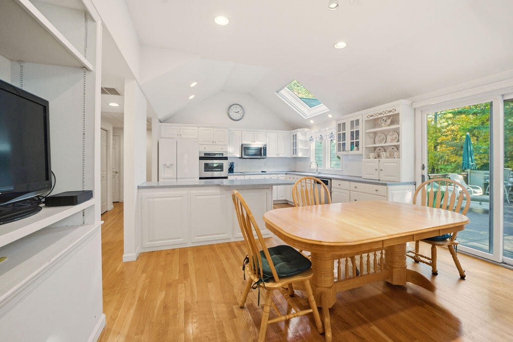 139 Falling Leaf Lane Osterville, MA 02655 - Photo 15 of 40 a kitchen with stainless steel appliances granite countertop a kitchen island hardwood floor and a sink