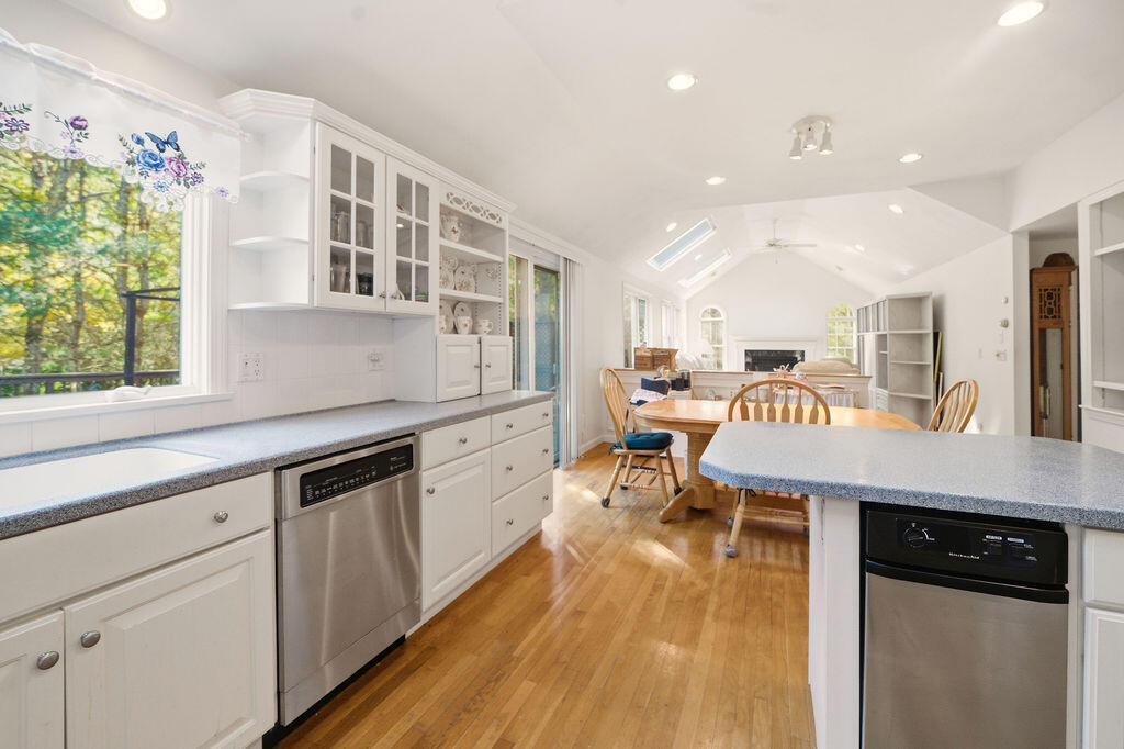 139 Falling Leaf Lane Osterville, MA 02655 - Photo 19 of 40 a kitchen with stainless steel appliances granite countertop lots of counter top space and furniture