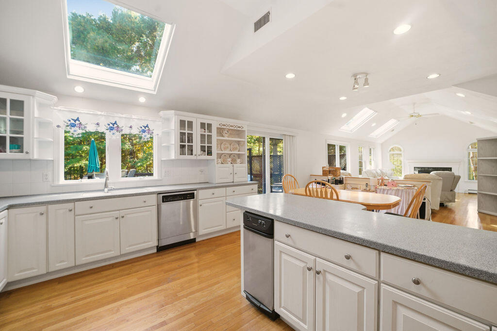 139 Falling Leaf Lane Osterville, MA 02655 - Photo 20 of 40 a kitchen with sink stove and cabinets