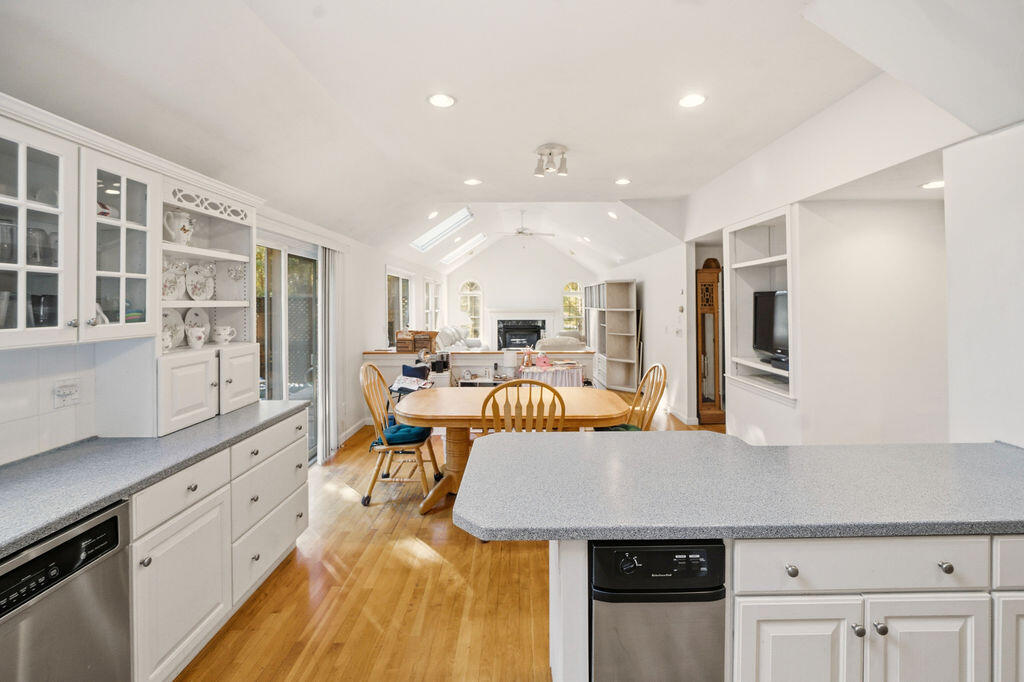 139 Falling Leaf Lane Osterville, MA 02655 - Photo 21 of 40 a living room with stainless steel appliances kitchen island granite countertop a refrigerator a stove and a cabinets with wooden floor