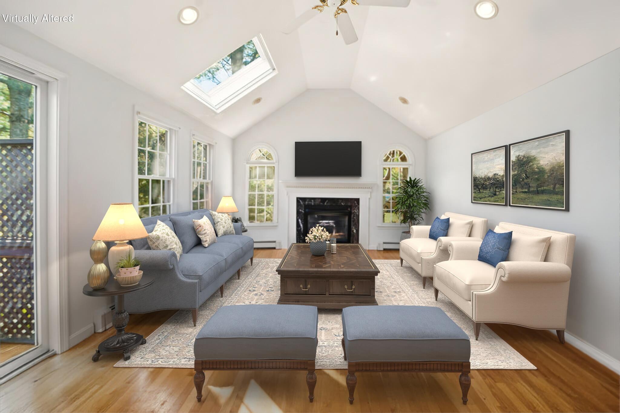 139 Falling Leaf Lane Osterville, MA 02655 - Photo 23 of 40 a living room with furniture a flat screen tv and a fireplace