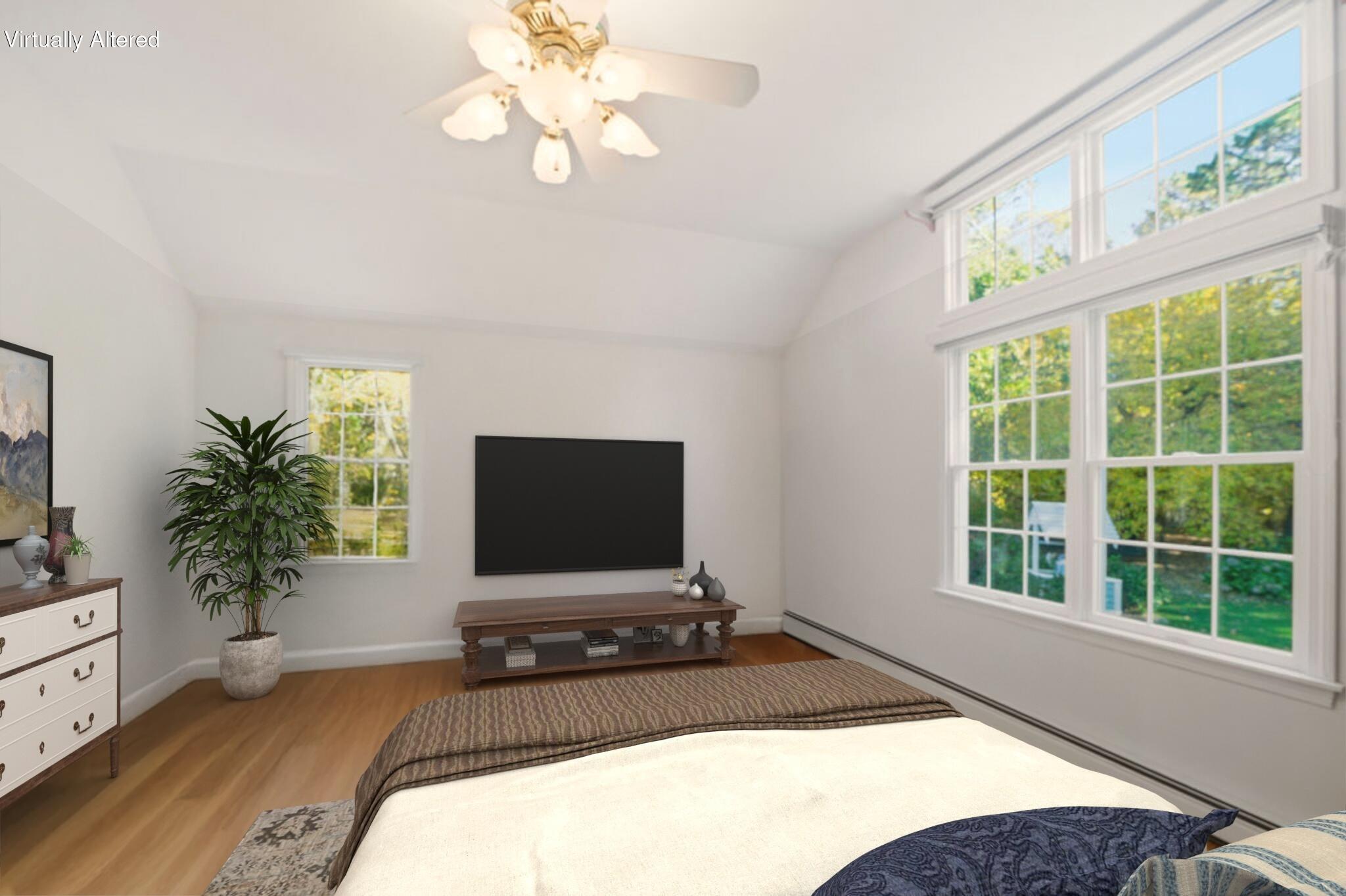 139 Falling Leaf Lane Osterville, MA 02655 - Photo 27 of 40 a bedroom with a bed and a flat screen tv