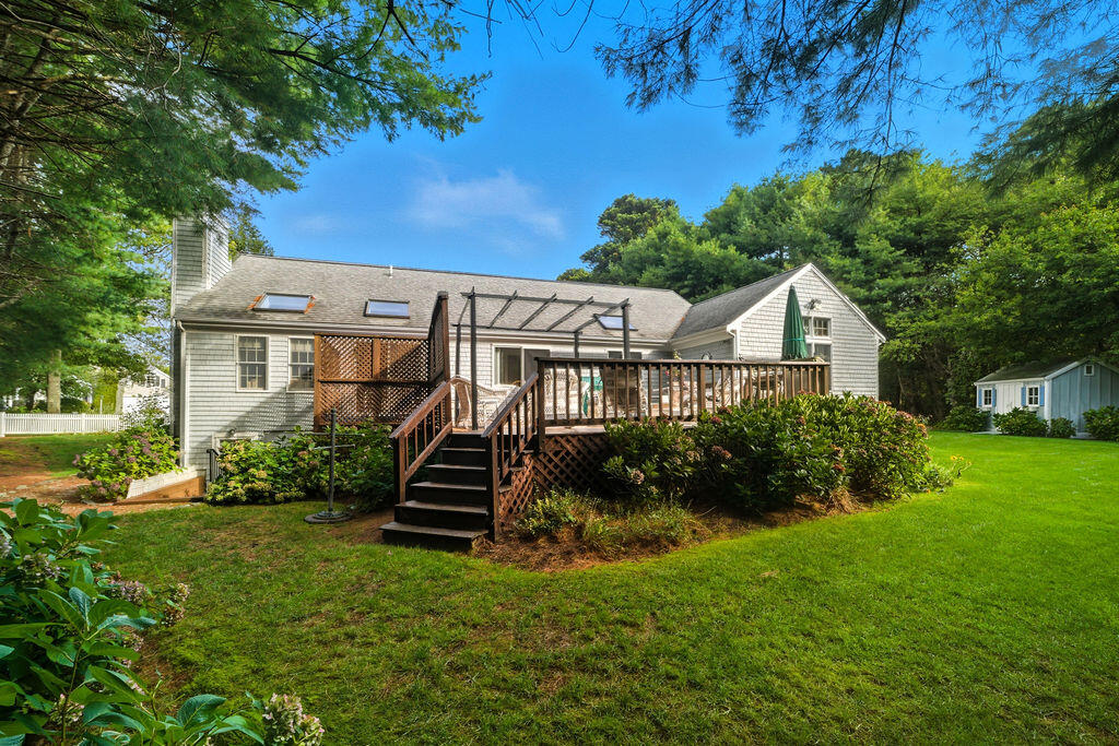 139 Falling Leaf Lane Osterville, MA 02655 - Photo 3 of 40 a front view of a house with a yard