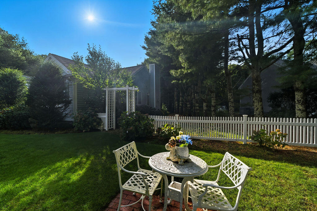 139 Falling Leaf Lane Osterville, MA 02655 - Photo 5 of 40 a view of table and chairs and couches in the patio