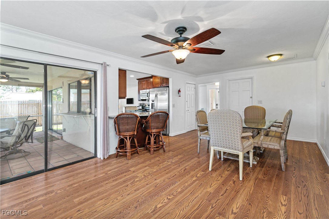 3717 Hanover Street Fort Myers, FL 33901 - Photo 14 of 41 a view of a dining room with furniture window and wooden floor