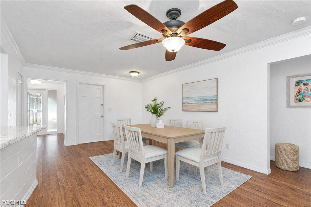 3717 Hanover Street Fort Myers, FL 33901 - Photo 15 of 41 a view of a dining room with furniture and wooden floor