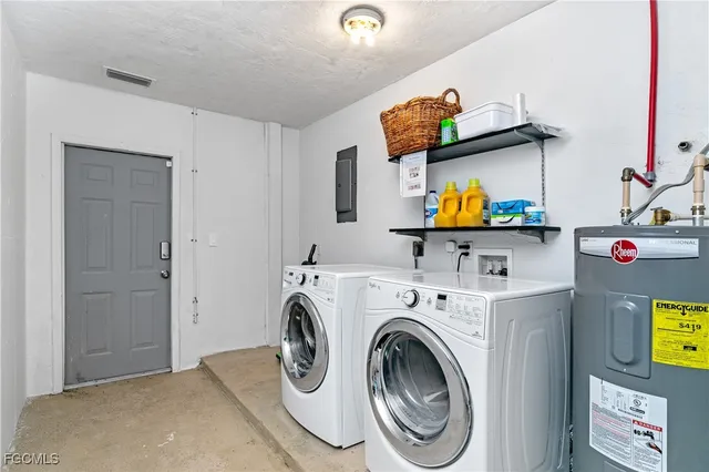 a view of storage and utility room with washer and dryer
